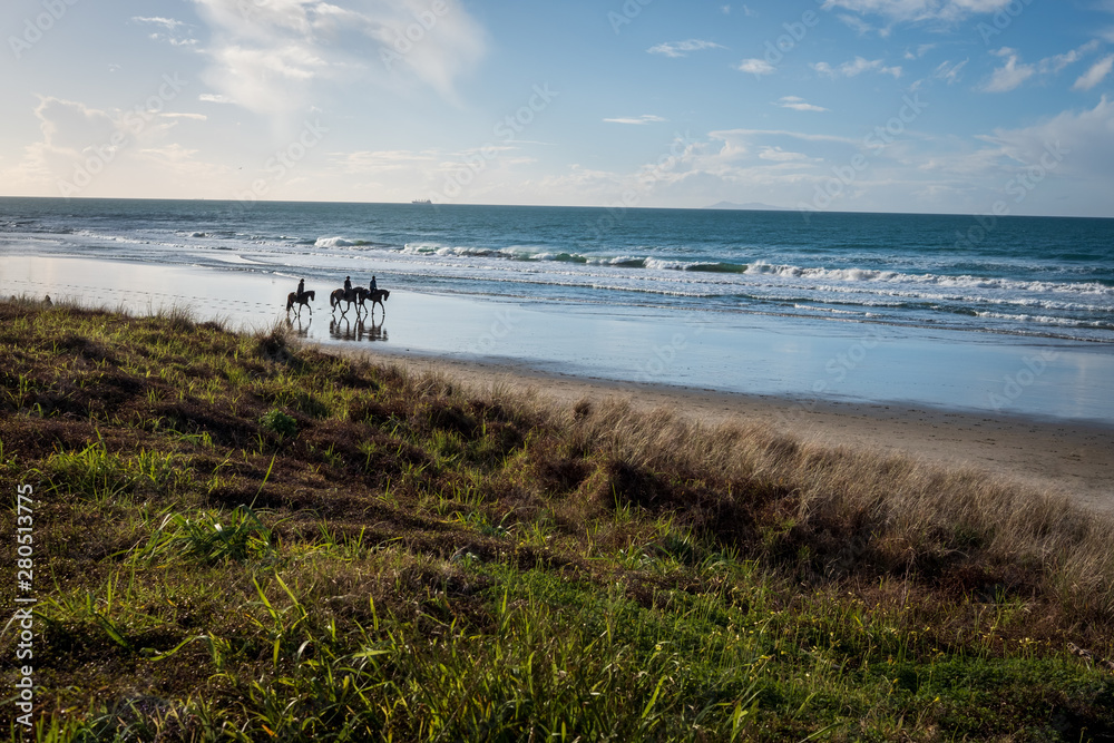 horserising along the beach