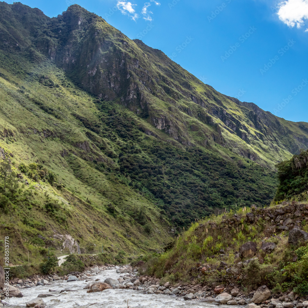 The Santa Teresa River in green lush valley. Hiking trail to Machu Picchu, Peru The Santa Teresa River in green lush valley. Hiking trail to Machu Picchu, Peru