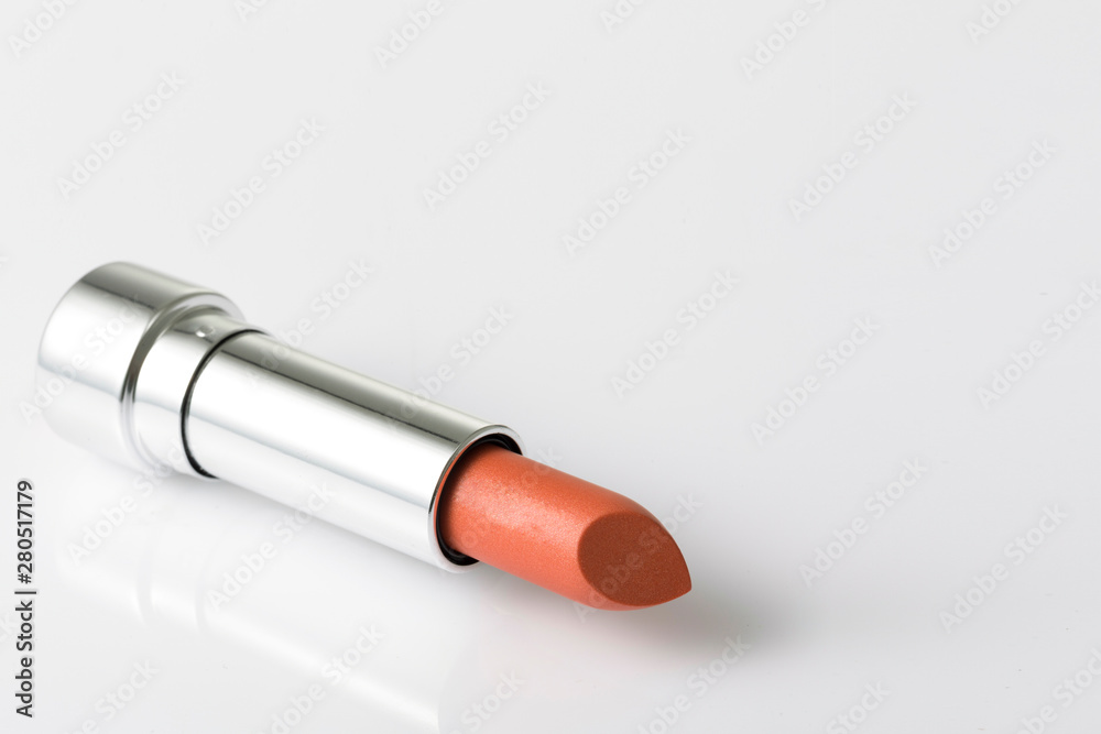 Lipstick lay on acrylic table with empty space on the right side Lipstick lay on acrylic table with empty space on the right side