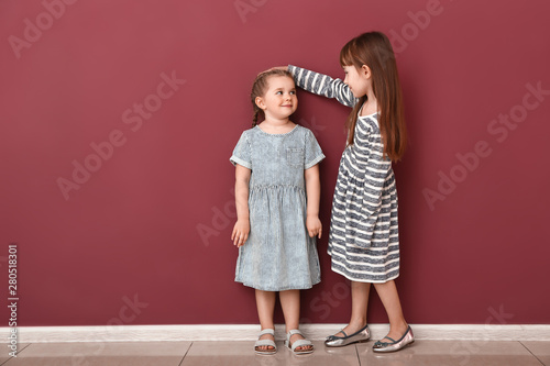 Little girls measuring heig...