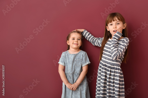 Little girls measuring heig...