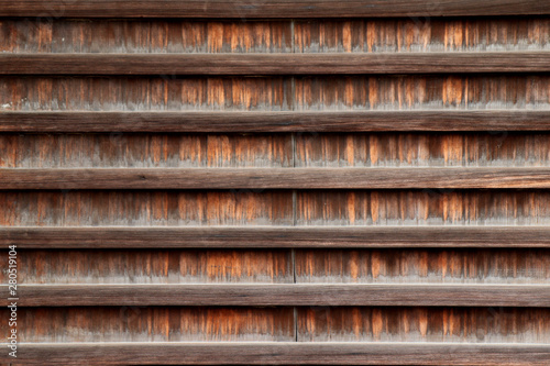 Texture of old wood japanese art of outsite temple wall.