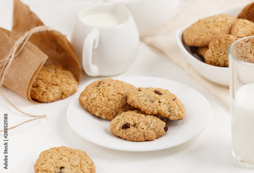 Sweet oatmeal cookies with nuts on the plate Sweet oatmeal cookies with nuts on the plate
