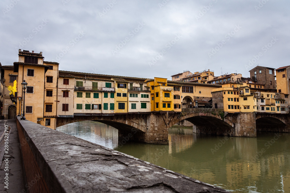Ponte Vecchio in Florence Italy. Early winter morning in Florence. Rain In The Old Town. Deserted Ponto Vecchio. Medieval city.