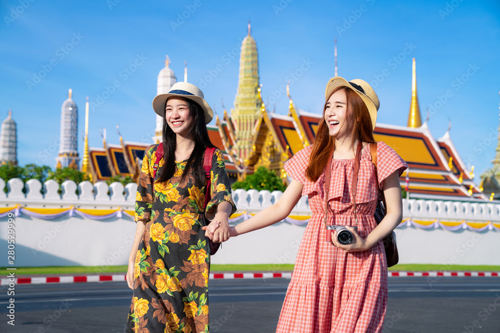 Two asian girlfriends traveling and take photo in Grand Palace and Wat phra kaew Two asian girlfriends traveling and take photo in Grand Palace and Wat phra kaew