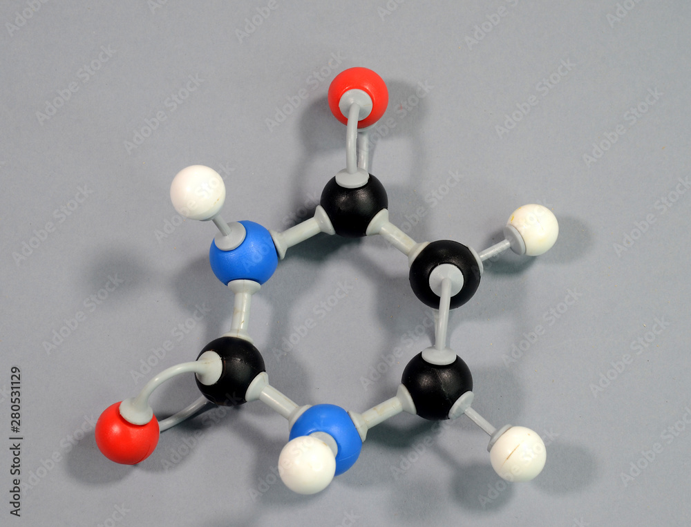 Obraz premium Molecule model of the DNA element Uracil. Black is Carbon, Red is Oxygen, White is Hydrogen, Blue is Nitrogen