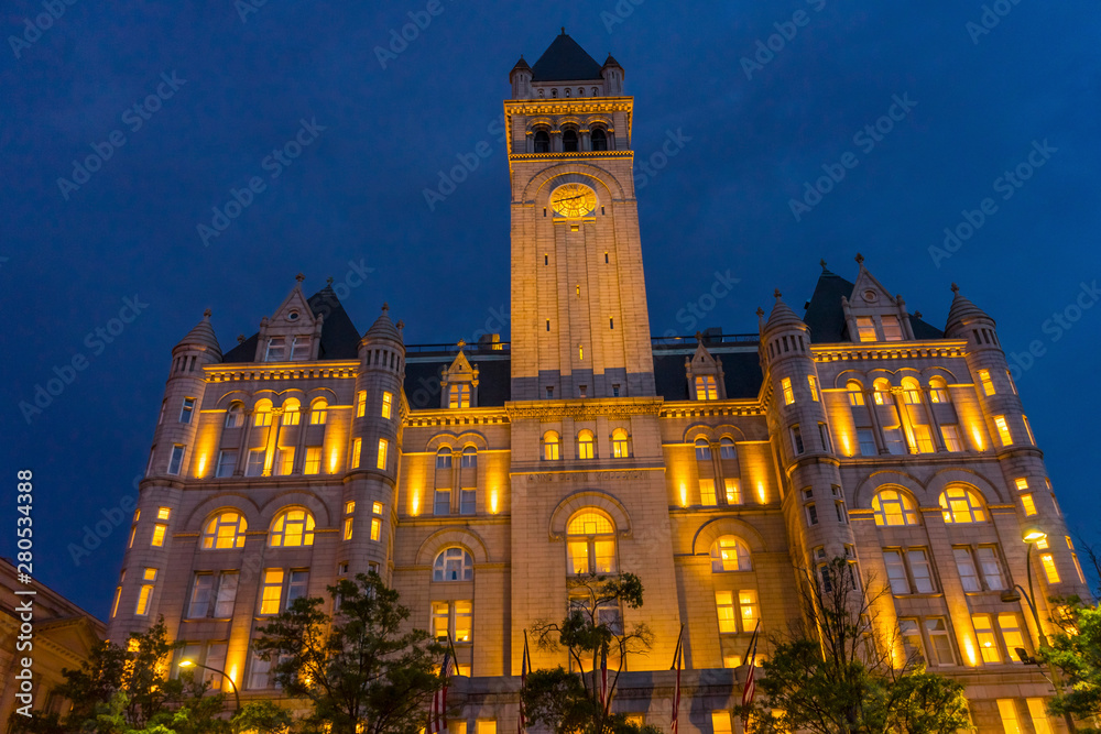 Fototapeta premium Illuminated Old Post Office Building Evening Washington DC