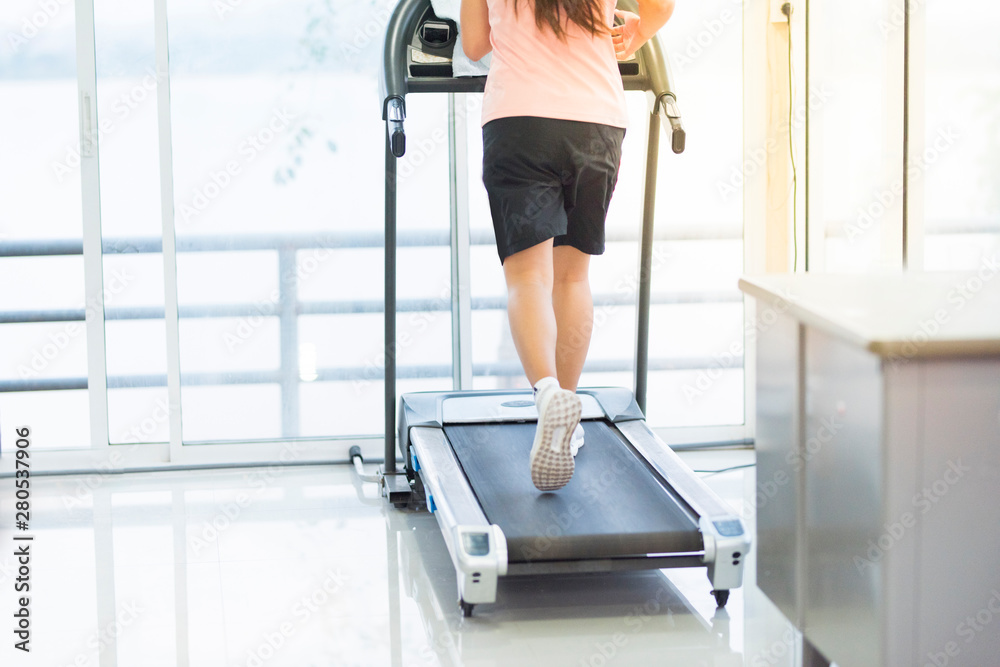 leg of asian woman running on machine,workout and exercise lifestyle.