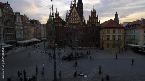 Timelapse of the sunset over the marketplace on a cloudy summer day in Wroclaw, Poland photo