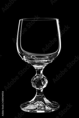 Silhouette of a glass wine glass on a black background