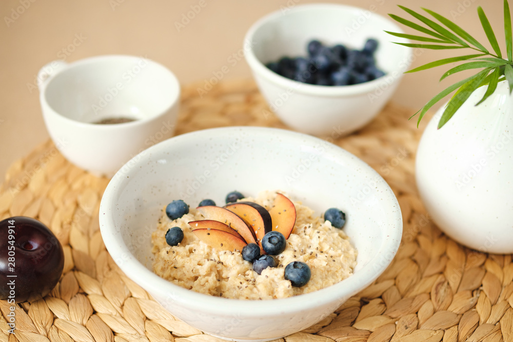 tasty porridge with blueberries, plums and chia seeds. tasty porridge with blueberries, plums and chia seeds.