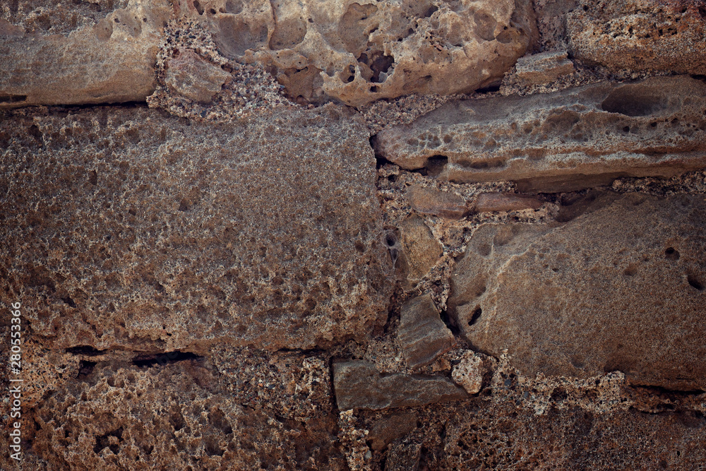 Obraz premium The old masonry of roughly processed stones