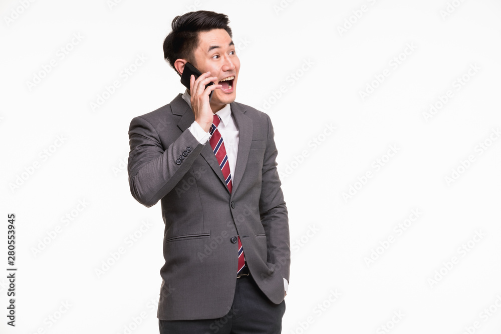 Businessman using smartphone, excited by it.. Businessman using smartphone, excited by it..