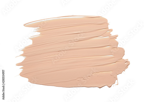 Gently beige strokes and texture of face highlighter or acrylic paint isolated on white background