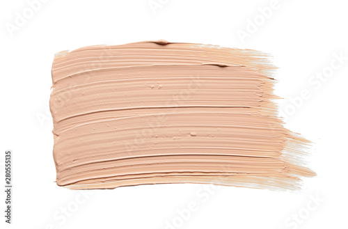 Gently beige strokes and texture of face highlighter or acrylic paint isolated on white background