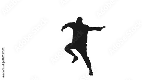 Young beautiful girl dancing hip hop, street dancing in a studio,black silhouette on white background, isolated