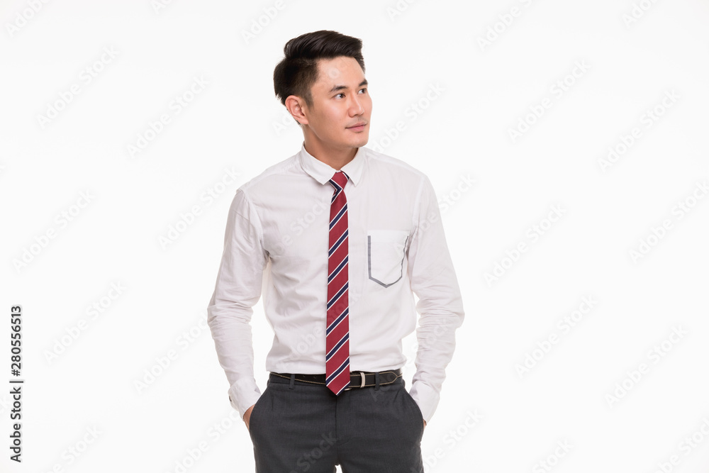 Asian businessman standing and point his finger.. Asian businessman standing and point his finger..