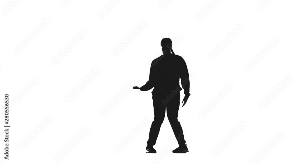 Young beautiful girl dancing hip hop, street dancing in a studio,black silhouette on white background, isolated Young beautiful girl dancing hip hop, street dancing in a studio,black silhouette on white background, isolated