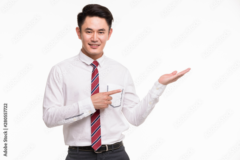Asian businessman standing and point his hands.. Asian businessman standing and point his hands..