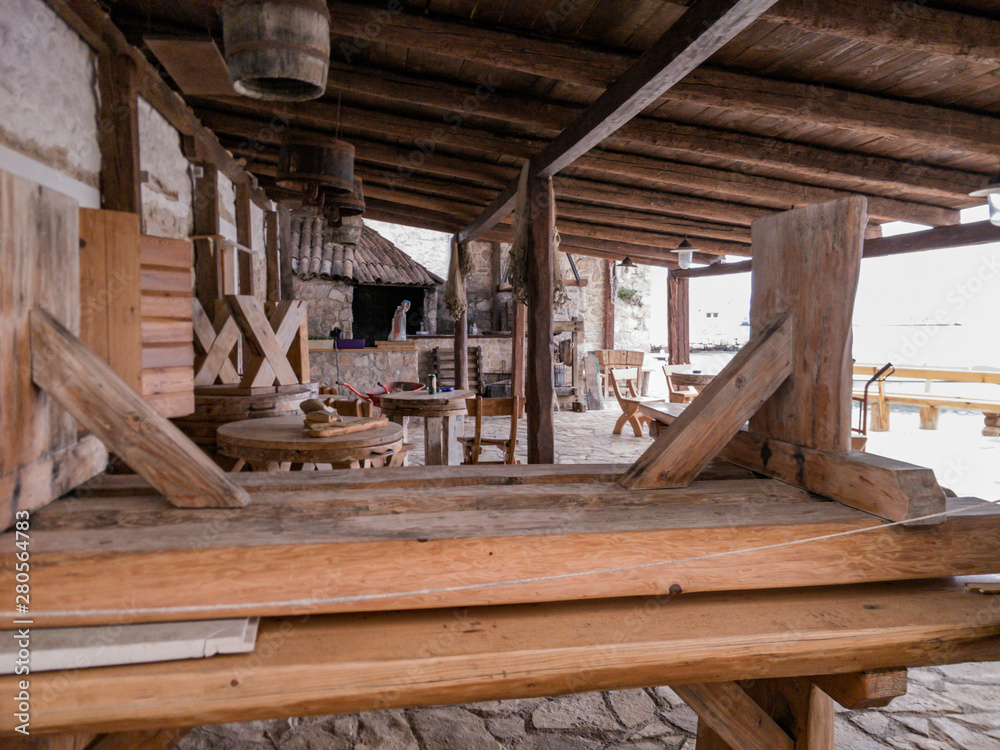 Stacked sitting wooden benches at seaside fish tavern. Stacked sitting wooden benches at seaside fish tavern.