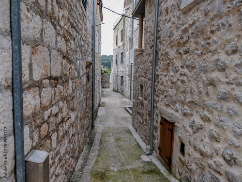 Fototapeta Naklejka Na Ścianę i Meble -  Old fishing village narrow streets between stone build houses.