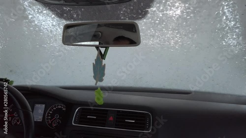 Car on an automatic car wash, shooting from the inside
