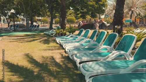 Empty sunbeds,sun loungers in a water park resort