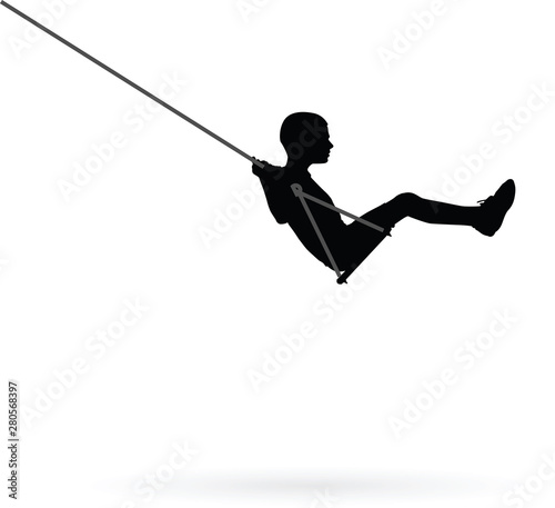 Boy swinging on a swing