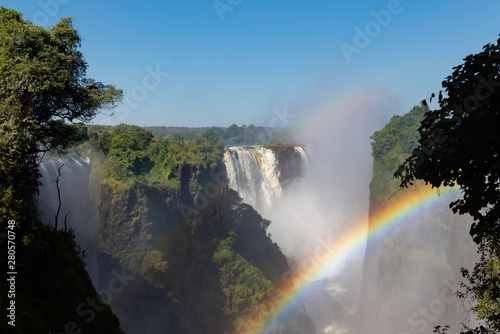 picture of the Victoria Falls and a rainbow while beautiful sunlight