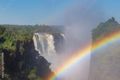 picture of the Victoria Falls and a rainbow while beautiful sunlight