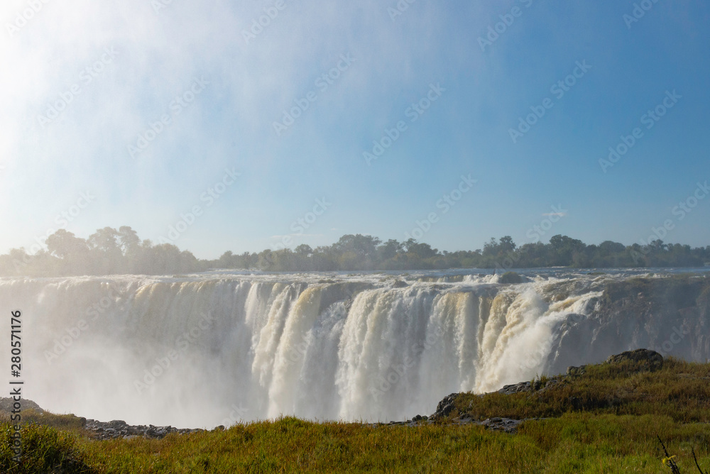 picture of the Victoria Falls and a rainbow while beautiful sunlight