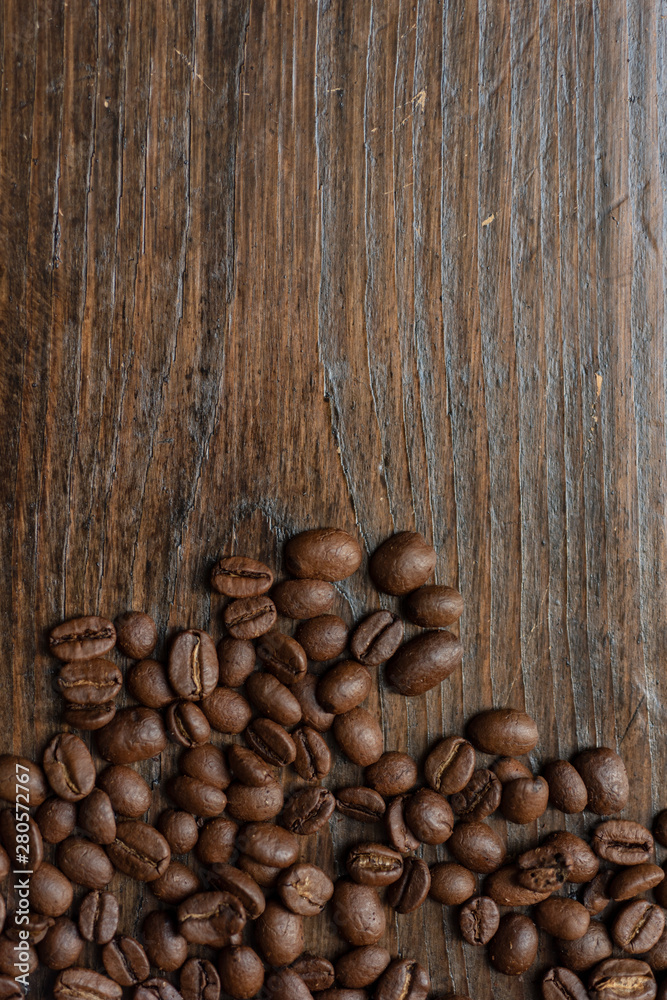 coffee beans on wooden background coffee beans on wooden background