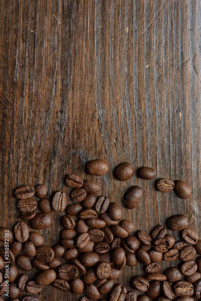 coffee beans on wooden background coffee beans on wooden background