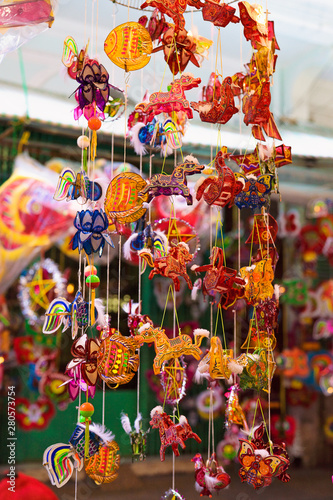 Colorful of tradition lanterns hanging on street in chinatown lantern market, Saigon, Vietnam. Many kind of beautiful plastic lanterns in Mid Autumn Festival. National and cultural holiday.