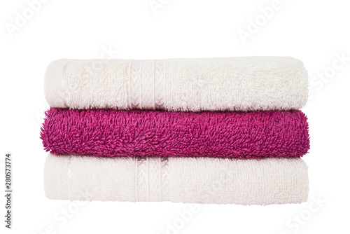 Pink and white bath towels in stack isolated over white background with clipping path