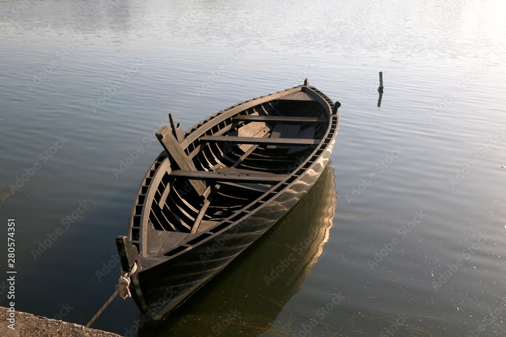 Traditional historic wooden boat called Condura Croatica, in port of Nin, Croatia.