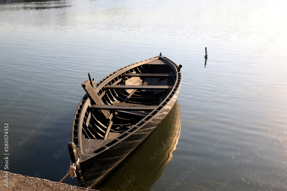 Traditional historic wooden boat called Condura Croatica, in port of Nin, Croatia.