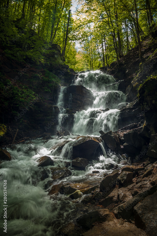 Naklejka premium Rapid waterfall in the Carpathian Mountains