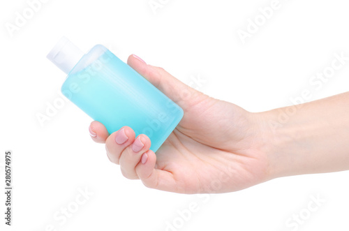 Bottle acetone nail polish remover in hand on white background isolation