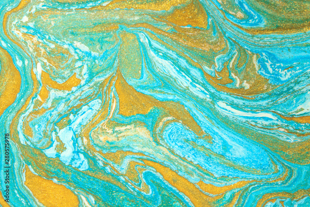 Abstract background made with liquid art technique. Blue golden trend background.