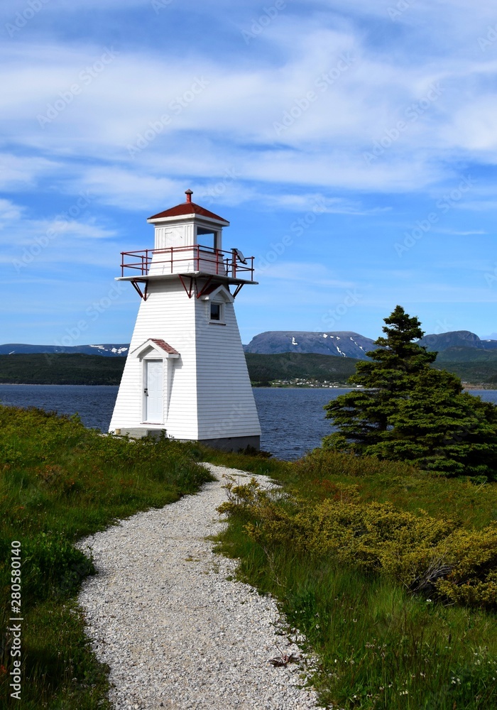 closeup of the red and white lighthouse in Woody Point, Gros Morne National Park Newfoundland and Labrador Canada