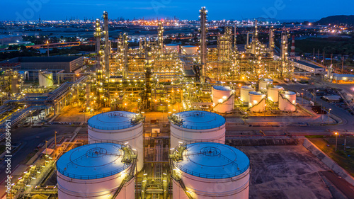 Aerial view petrochemical plant and oil refinery plant background at night,  Petrochemical oil refinery factory plant at night. photo