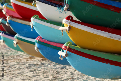 Billede på lærred Colorful boats park on the beach