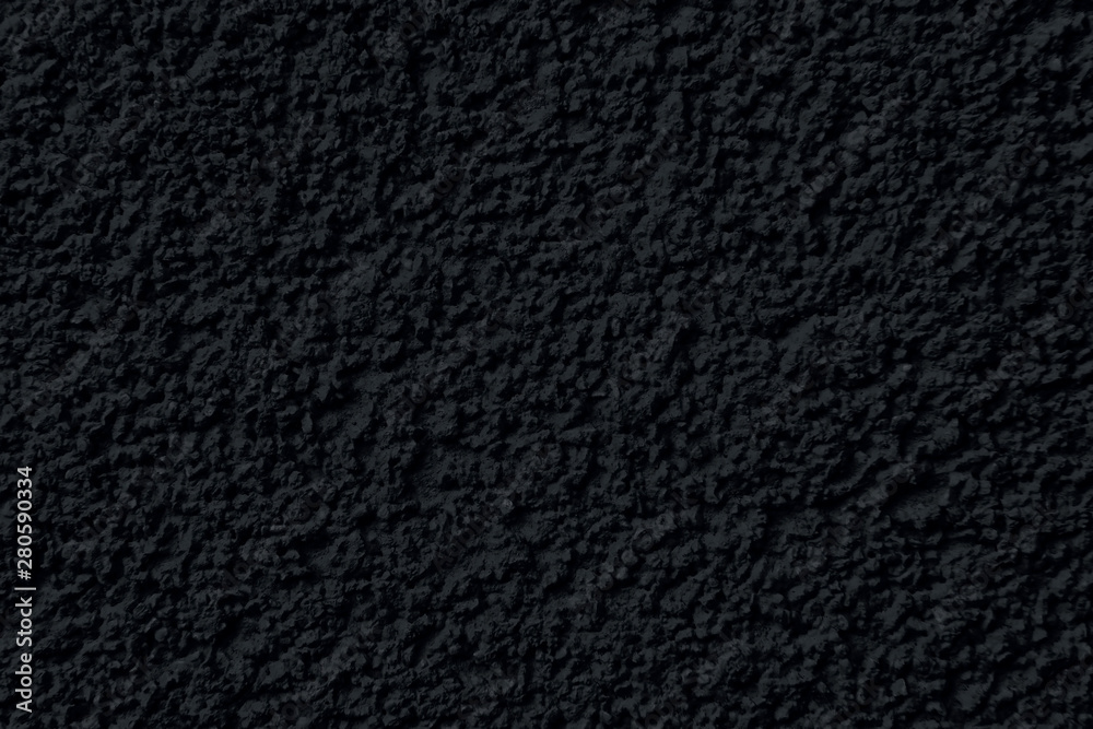 fragment of rough black plaster on the wall for background fragment of rough black plaster on the wall for background