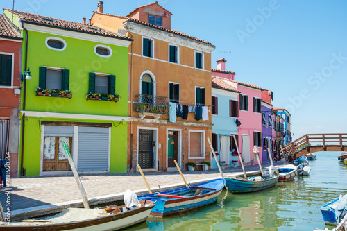 Burano island, Italy. View of a bridge and the colored houses near the canal on the island of Burano © allai