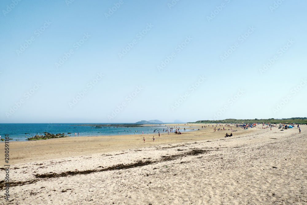 25 July 2019. People relax on the beach. Scotland is hot. Yellowcraig beach