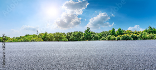 Fototapeta Naklejka Na Ścianę i Meble -  Asphalt highway and green forest with beautiful clouds landscape