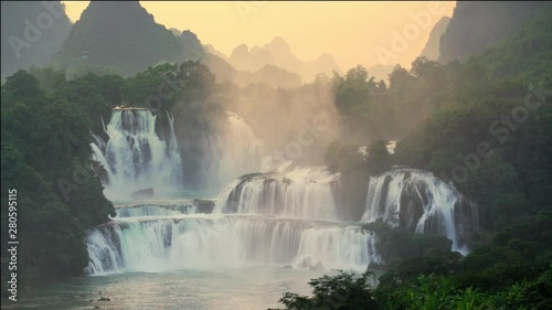 Sunrise bird eye view Bangioc waterfall in Vietnam and Detian waterfall in China, located near border, people can see this waterfall both of country, Lockdown.. photo