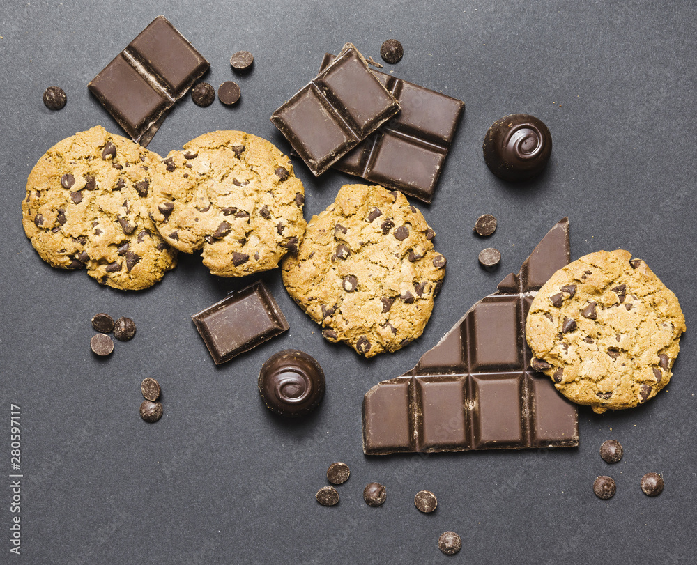 Flat lay arrangement with dark chocolate and cookies
