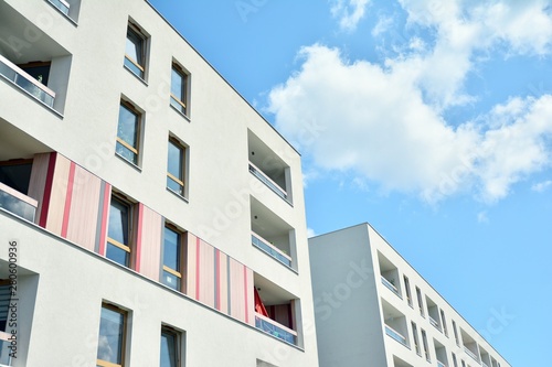 modern apartment building with blue sky and clouds © Grand Warszawski